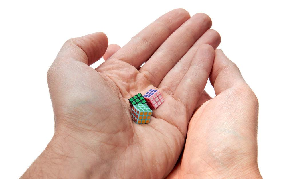 Mini 1cm 3x3 World's Smallest Cube black in hand